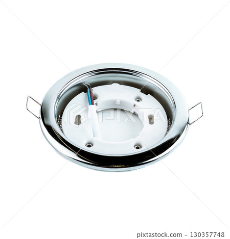 Round light gray metal recessed ceiling light fixture frame for spotlights, displayed in a stretch ceiling and lighting equipment store. Round light gray metal recessed ceiling light fixture frame for spotlights, displayed in a stretch ceiling and lighting equipment store. 130357748