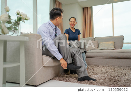 A casual conversation occurs in a stylish, comfortable modern living room A casual conversation occurs in a stylish, comfortable modern living room 130359012