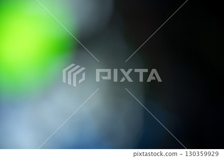 Abstract blurred background with a soft color gradient in shades of green, blue, and black. Texture or background in various designs 130359929
