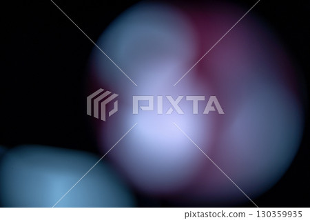 A colorful abstract background featuring blurred light bokeh circles against a dark or black background. The bokeh lights are in colorful, vibrant shades, creating a festive and magical atmosphere A colorful abstract background featuring blurred light bokeh circles against a dark or black background. The bokeh lights are in colorful, vibrant shades, creating a festive and magical atmosphere 130359935