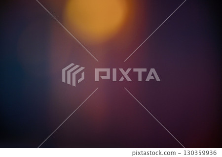 A colorful abstract background featuring blurred light bokeh circles against a dark or black background. The bokeh lights are in colorful, vibrant shades, creating a festive and magical atmosphere A colorful abstract background featuring blurred light bokeh circles against a dark or black background. The bokeh lights are in colorful, vibrant shades, creating a festive and magical atmosphere 130359936