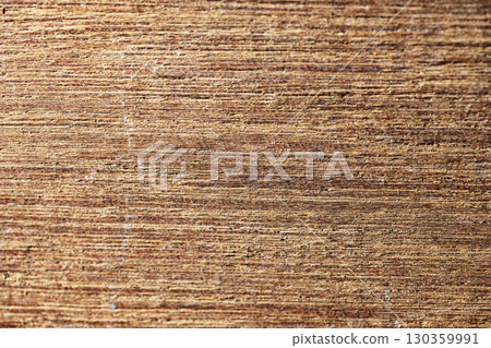 Closeup view of the intricate grain pattern of rustic hardwood surface. Wood texture background 130359991