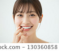 Woman showing white teeth 130360858