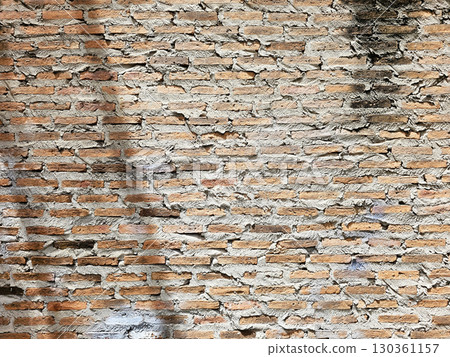 Old Red Brick Wall Texture Background with Mortar and Grime. 130361157