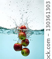 The moment an apple sinks into the water 130361303