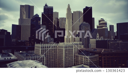 The skyline showcases towering skyscrapers against a dramatic sky at twilight. The blend of modern and classic architecture highlights the citys vibrant energy and allure. 130361423