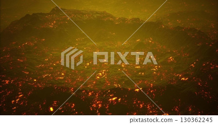 Glowing lava flows create a mesmerizing sight as they move across the rocky terrain, producing bright orange hues under a smoky sky during the evening. The heat of the eruption is palpable. 130362245