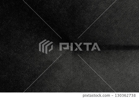 Old wrinkled fold of black rough cardboard sheet. Paper dark abstract background Old wrinkled fold of black rough cardboard sheet. Paper dark abstract background 130362738