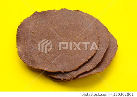 Fermented soybean discs, known as Thua Nao a traditional Thai seasoning used to enhance flavor in Northern cuisine. Fermented soybean discs, known as Thua Nao a traditional Thai seasoning used to enhance flavor in Northern cuisine. 130362801