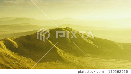 Endless golden hills stretch across the horizon under a soft yellow sky. The rugged mountains rise gently, creating a peaceful and otherworldly atmosphere. Endless golden hills stretch across the horizon under a soft yellow sky. The rugged mountains rise gently, creating a peaceful and otherworldly atmosphere. 130362956