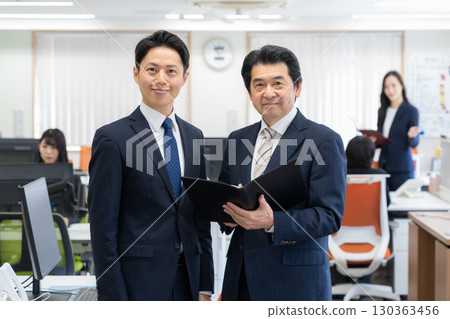 Male and female businessmen making meetings Male and female businessmen making meetings 130363456