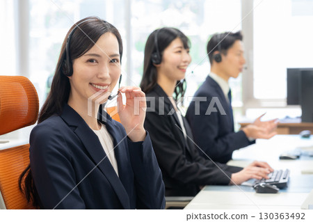 Male and female call center operators 130363492