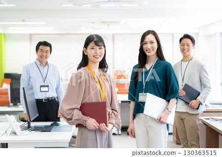 Male and female engineers working in the office 130363515