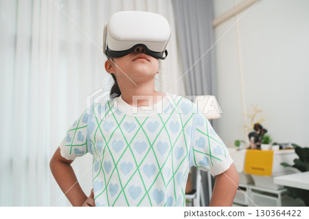 Girl Student Using VR Headset Education and Gaming Concept 130364422