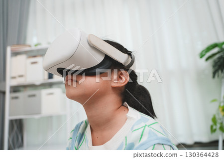 Young user experiencing 3D simulation. Modern edutainment technology. Young user experiencing 3D simulation. Modern edutainment technology. 130364428