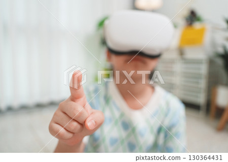 Girl Interacting with Virtual Reality by Touch Gesture Girl Interacting with Virtual Reality by Touch Gesture 130364431