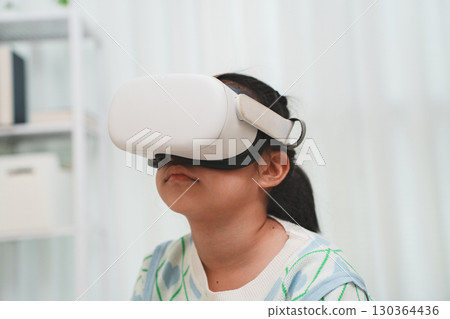 Girl Exploring VR with Headset Learning and Play Girl Exploring VR with Headset Learning and Play 130364436