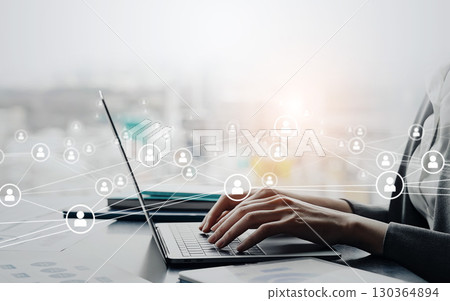 Woman using laptop and communication network concept 130364894