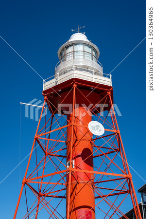 Red lighthouse with metal structure under blue sky in Adelaide, Australia Red lighthouse with metal structure under blue sky in Adelaide, Australia 130364966