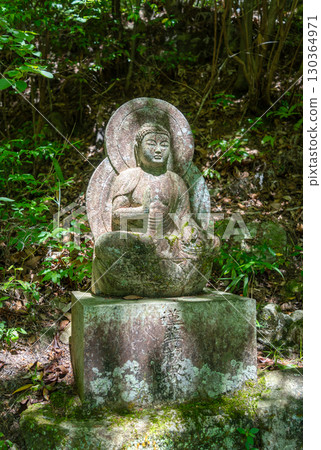 Amida Buddha statue at Mitaki-Dera temple in Hiroshima, Japan 130364971