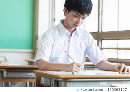 high school student taking a test 130365127