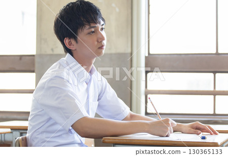 Male high school student studying Male high school student studying 130365133