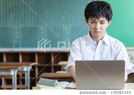 High school boy using a computer High school boy using a computer 130365143