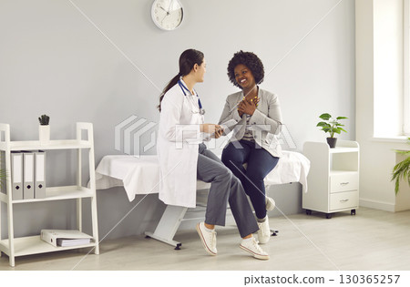 Female GP doctor having discussion about patient diagnosis 130365257