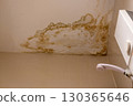 Bathroom ceiling with visible moisture stains showing dampness, humidity, and water damage 130365646