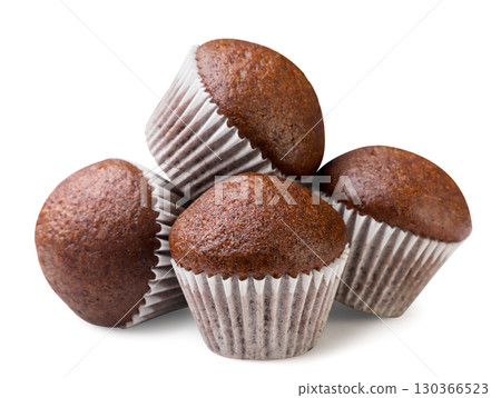 Pile of chocolate muffins close-up on a white background. Isolated Pile of chocolate muffins close-up on a white background. Isolated 130366523
