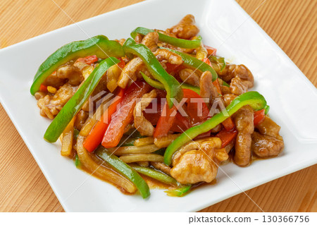 A plate full of stir-fried chicken with green peppers5 130366756