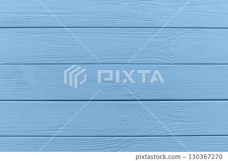 Light blue painted horizontal wooden planks provide a rustic and textured background, perfect for design projects 130367270