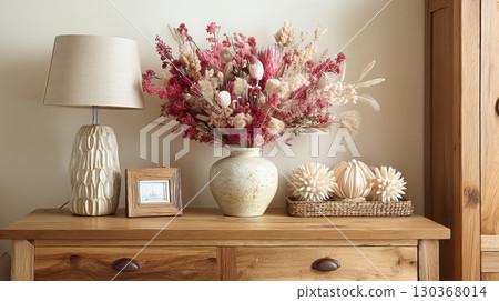 Cozy Wooden Dresser with Floral Arrangement and Lamp 130368014
