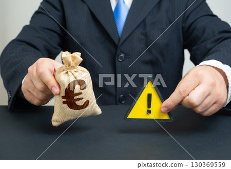 Euro money bag and a sign of caution. Lack of money. Budget problems. Inflation, saving money. Financial difficulties, household economy, currency risks, cost of living, government deficit 130369559
