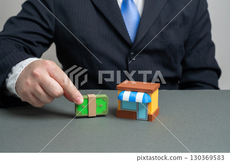 Businessman invests in a business store. Buying out the premises. Creating a franchise. Investments. Retail expansion, entrepreneurship, business ownership, growth capital, long-term strategy Businessman invests in a business store. Buying out the premises. Creating a franchise. Investments. Retail expansion, entrepreneurship, business ownership, growth capital, long-term strategy 130369583