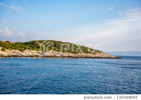 Uninhabited islands of the Lastovo National Park surrounded by calm sea in Croatia. Nature reserve, remote landscape and Mediterranean summer escape 130369695