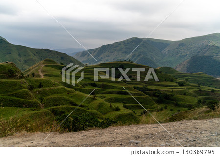 Chokhsky terraces Dagestan. Landscape of mountainous Dagestan with terraced fields and peaks mountains in the distance. Chokhsky terraces Dagestan. Landscape of mountainous Dagestan with terraced fields and peaks mountains in the distance. 130369795
