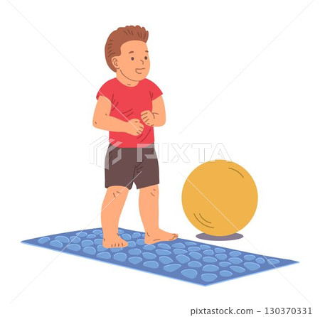 Boy walking on massage mat exercise Boy walking on massage mat exercise 130370331