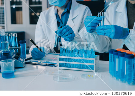 Collaboration, tablet or science with people in lab together for research or development. Innovation, tech and microscope with scientist team in clinical trial for planning or medical investigation 130370619
