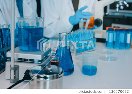 Collaboration, tablet or science with people in lab together for research or development. Innovation, tech and microscope with scientist team in clinical trial for planning or medical investigation Collaboration, tablet or science with people in lab together for research or development. Innovation, tech and microscope with scientist team in clinical trial for planning or medical investigation 130370622