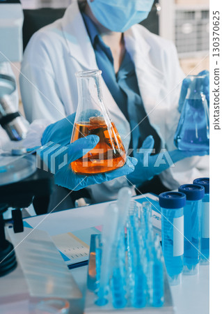 Collaboration, tablet or science with people in lab together for research or development. Innovation, tech and microscope with scientist team in clinical trial for planning or medical investigation 130370625