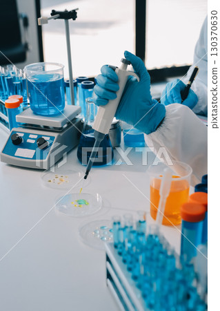 Collaboration, tablet or science with people in lab together for research or development. Innovation, tech and microscope with scientist team in clinical trial for planning or medical investigation 130370630