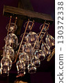 Glasses hanging from the bar ceiling 130372338