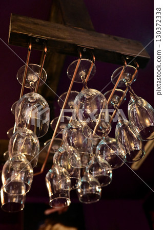 Glasses hanging from the bar ceiling Glasses hanging from the bar ceiling 130372338