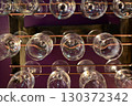 5 glasses hanging from the bar ceiling 130372342