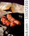 Sausages cooked in a cast iron skillet 4 130372350