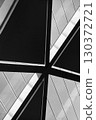 Geometric and figured abstraction of metal surfaces of regular shape and straight lines. Vertical black and white photo 130372721