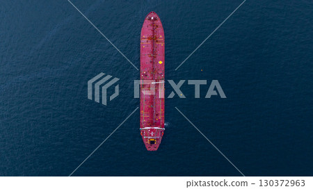 Aerial view crude oil tanker ship at sea, Red crude oil tanker ship top view, Logistic and maritime transpoprtation of petroleum, Modern offshore terminal  loading tanker ship. 130372963