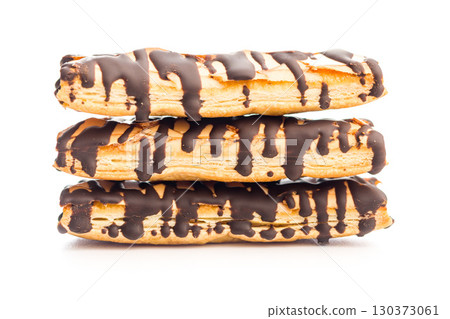Sfogliatine glassate with chocolate. Italian crispy dessert isolated on white background. Sfogliatine glassate with chocolate. Italian crispy dessert isolated on white background. 130373061