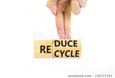 Reduce or recycle symbol. Concept words Reduce Recycle on wooden block. Beautiful white table white background. Businessman hand. Business reduce or recycle concept. Copy space. Reduce or recycle symbol. Concept words Reduce Recycle on wooden block. Beautiful white table white background. Businessman hand. Business reduce or recycle concept. Copy space. 130373163